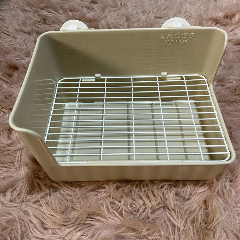 Small pets litter box and water bottle.